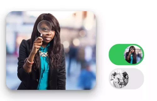 A black lady looking through a magnifying glass